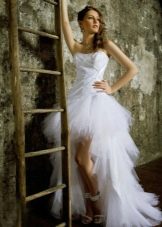 Short wedding dress with ruffles on a train