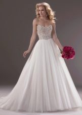 Lush wedding dress with a decorated corset