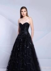 black floor-length evening dress with a fluffy skirt
