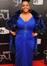 Elegant evening dress of large size with a fur coat