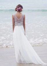 Wedding dress with a cut-out at the back and an empire train