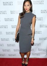Jamie Chang in a gray dress