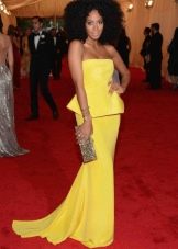 Long yellow dress with peplum and neckline
