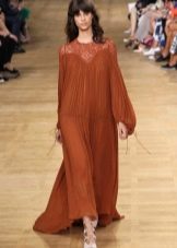 Long fluffy terracotta dress in translucent fabric