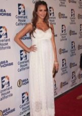 Long white dress on the floor with shoulder straps for pregnant women