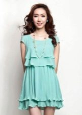 Short navy dress with ruffles on the skirt and chest