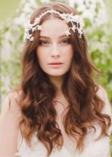 Wedding hairstyle in combination with hair decoration for a dress case
