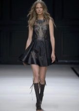 Nude tights under a leather dress