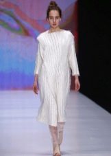 Knitted winter dress with sleeves