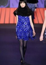 Black fishnet tights for a blue dress