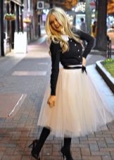 Fluffy skirt combined with a leather jacket