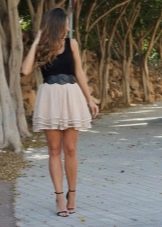 Layered beige skirt combined with a black tank top