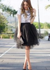Layered black skirt combined with a T-shirt