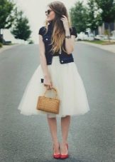 Layered skirt combined with a denim jacket
