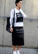 Below the knee skirt paired with sneakers