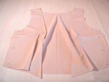 Stitching the side seams on the bodice of a haute couture evening dress