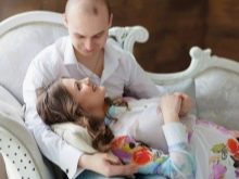 Photoshoot of a pregnant woman with her husband in a photo studio