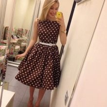 Brown dress with white polka dots with a full skirt