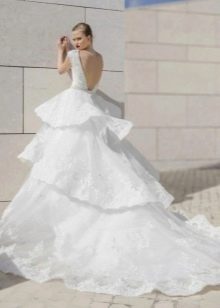Lush wedding dress with tiered skirt and train