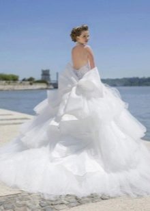 Lush wedding dress with a cascading skirt and a train