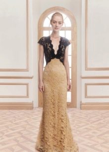 Long evening dress made of different types of guipure