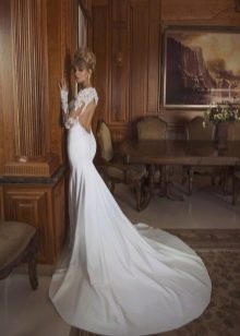 Floor-length white wedding dress with open back
