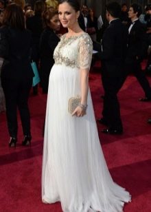 Long white dress in the floor with sleeves on the elbow for pregnant women