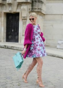 A-line dress paired with a cardigan and a briefcase