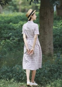 White long checkered shirt dress and a hat to it