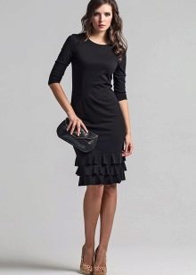 Black dress with ruffles at the hem