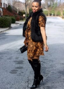 Wrap dress combined with a fur vest and boots