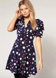 Dress in multi-colored polka dots of different sizes