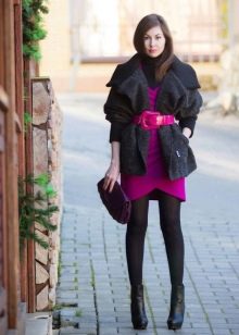 Black tights under a bright knitted dress