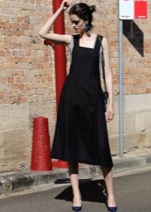Black mid-length pinafore dress with a loose skirt