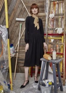 Knitted winter dress with sleeves