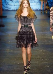 Fashionable translucent dress of the spring-summer 2016 season with a flounce
