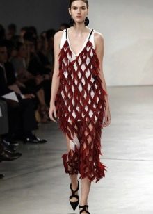 Fashionable dress of the season spring-summer 2016, trimmed with feathers