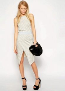 Asymmetric skirt and unusual handbag