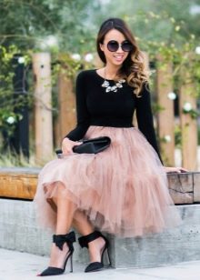 Layered skirt combined with a fitted top