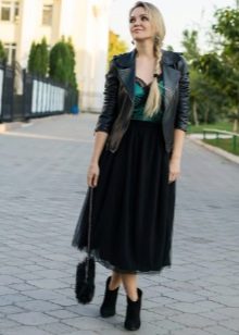 Long layered black skirt combined with a jacket