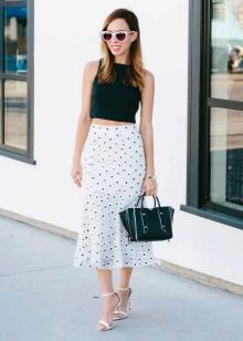 Mid-length white godet skirt with small polka dots for summer