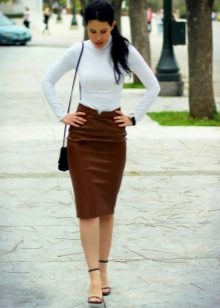 Straight brown skirt paired with a white turtleneck