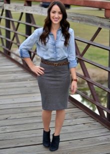 Gray pencil skirt paired with a leather strap and a denim shirt