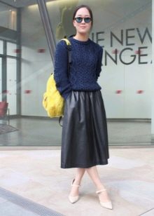 Below the knee leather skirt combined with a sweater