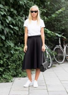 Below the knee skirt paired with sneakers