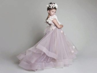 Luxurious wedding lush dress with a train for a girl