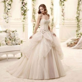 Lush wedding dress with a skirt of an abstract shape