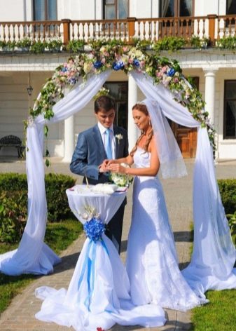 Combining a wedding dress with a groom's outfit