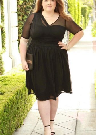 Black dress for plump combined with fabrics of different textures