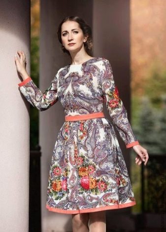 Staple dress in Russian style of medium length with large and small patterns